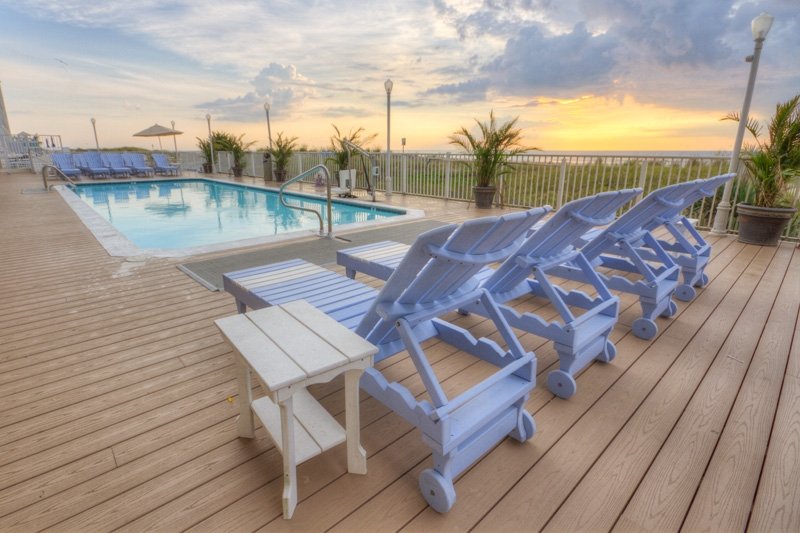 sun deck with chair at outside pool 